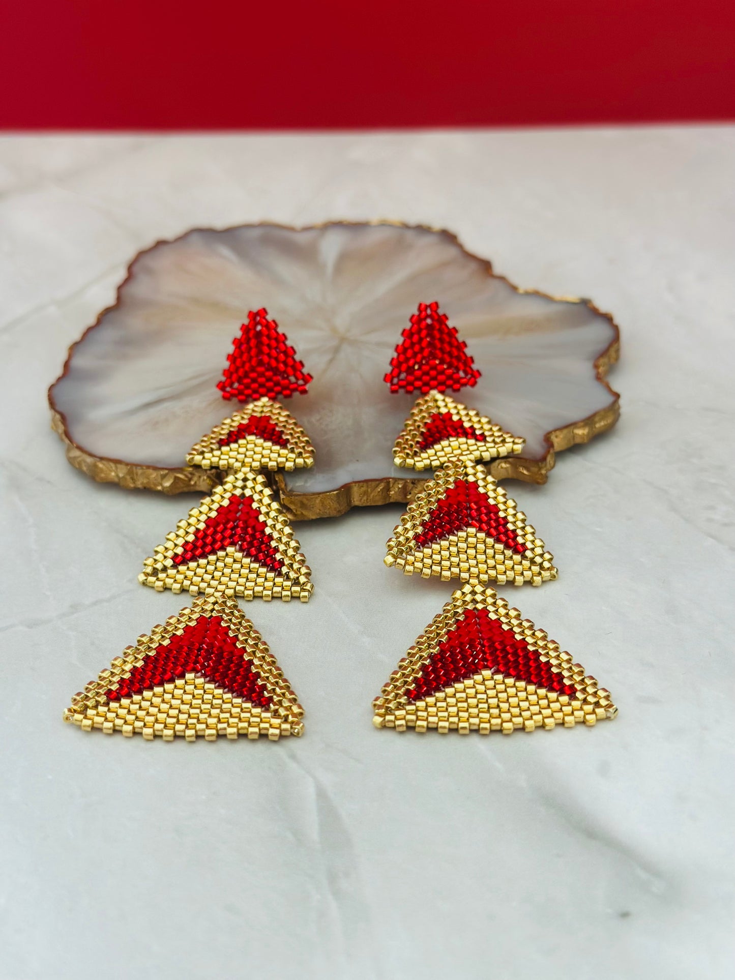 A- Aretes largos de Miyuki