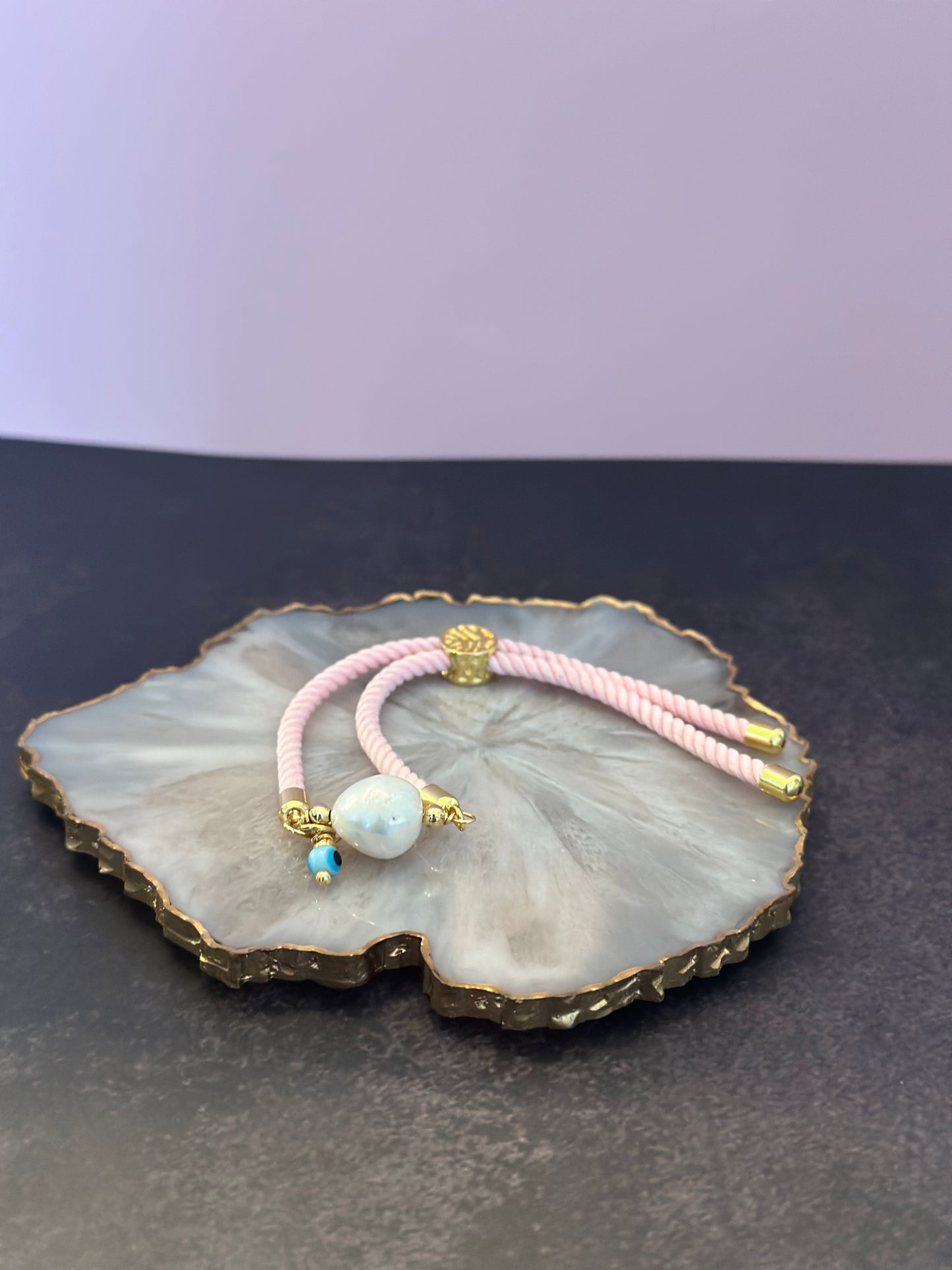 Pulseras en Cordón rosado con perla natural