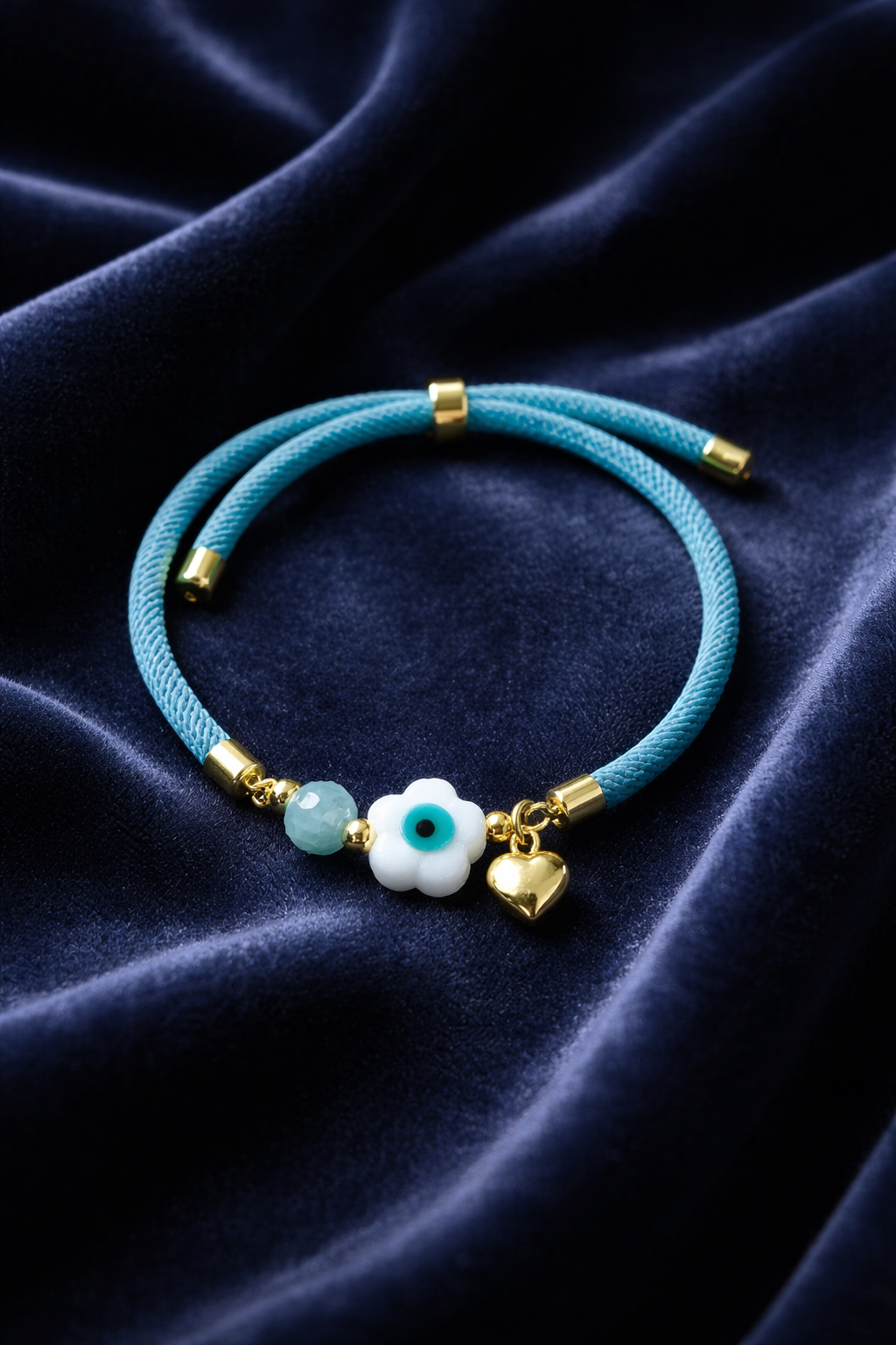 A Pulsera en cordón celeste con dije de Ojo Turco 🧿