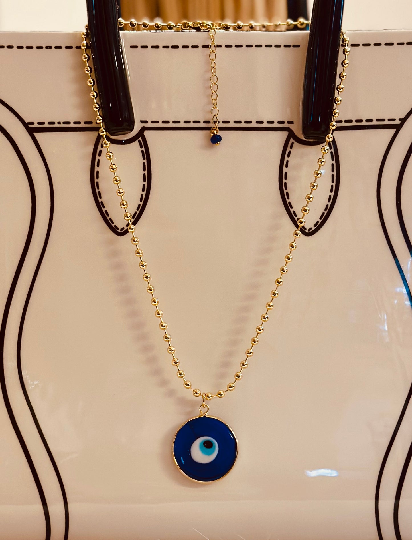 A Cadena estilo militar con baño de oro 18k y dije de Ojo Turco 🧿