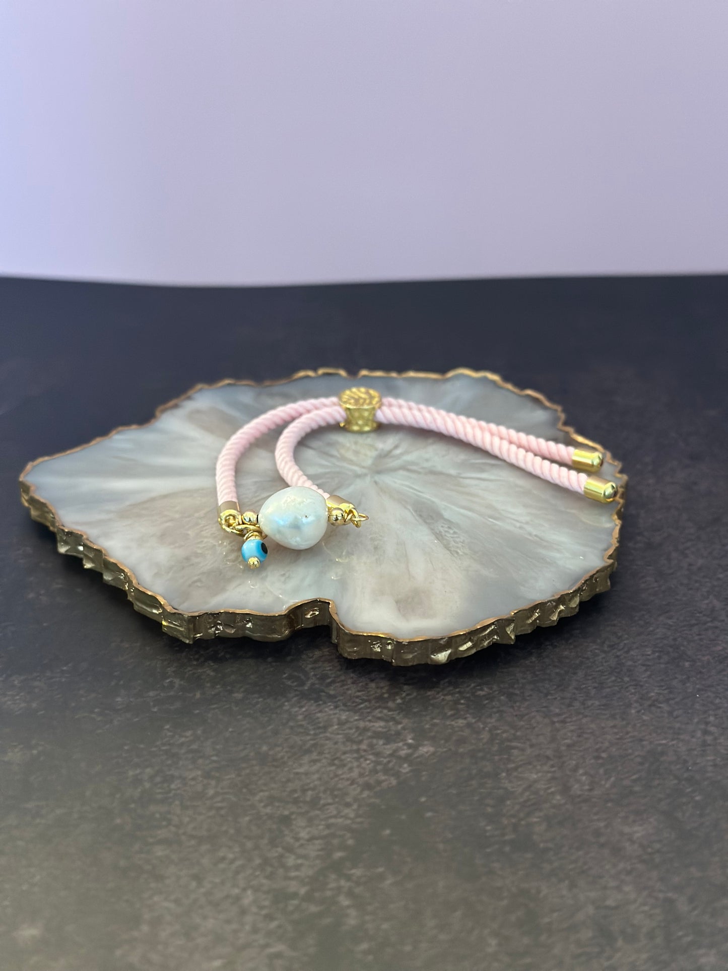 Pulseras en Cordón rosado con perla natural