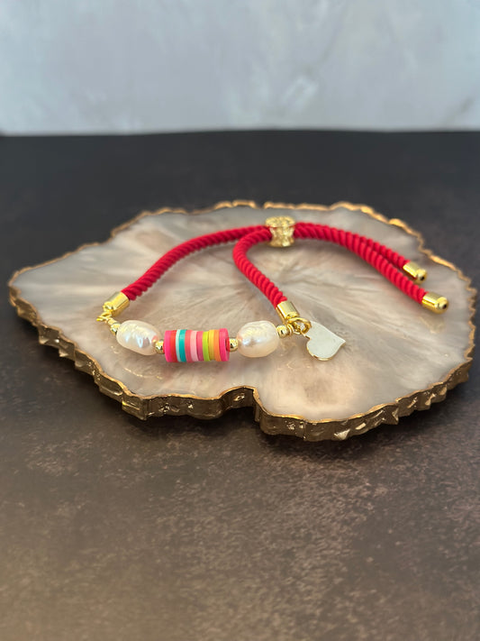 Pulseras en cordón fucsia con perlas naturales y fino