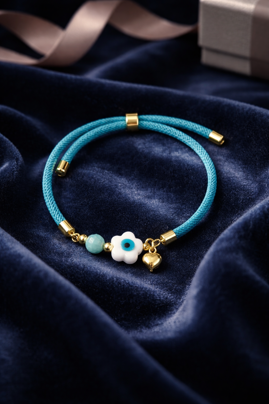 A Pulsera en cordón celeste con dije de Ojo Turco 🧿