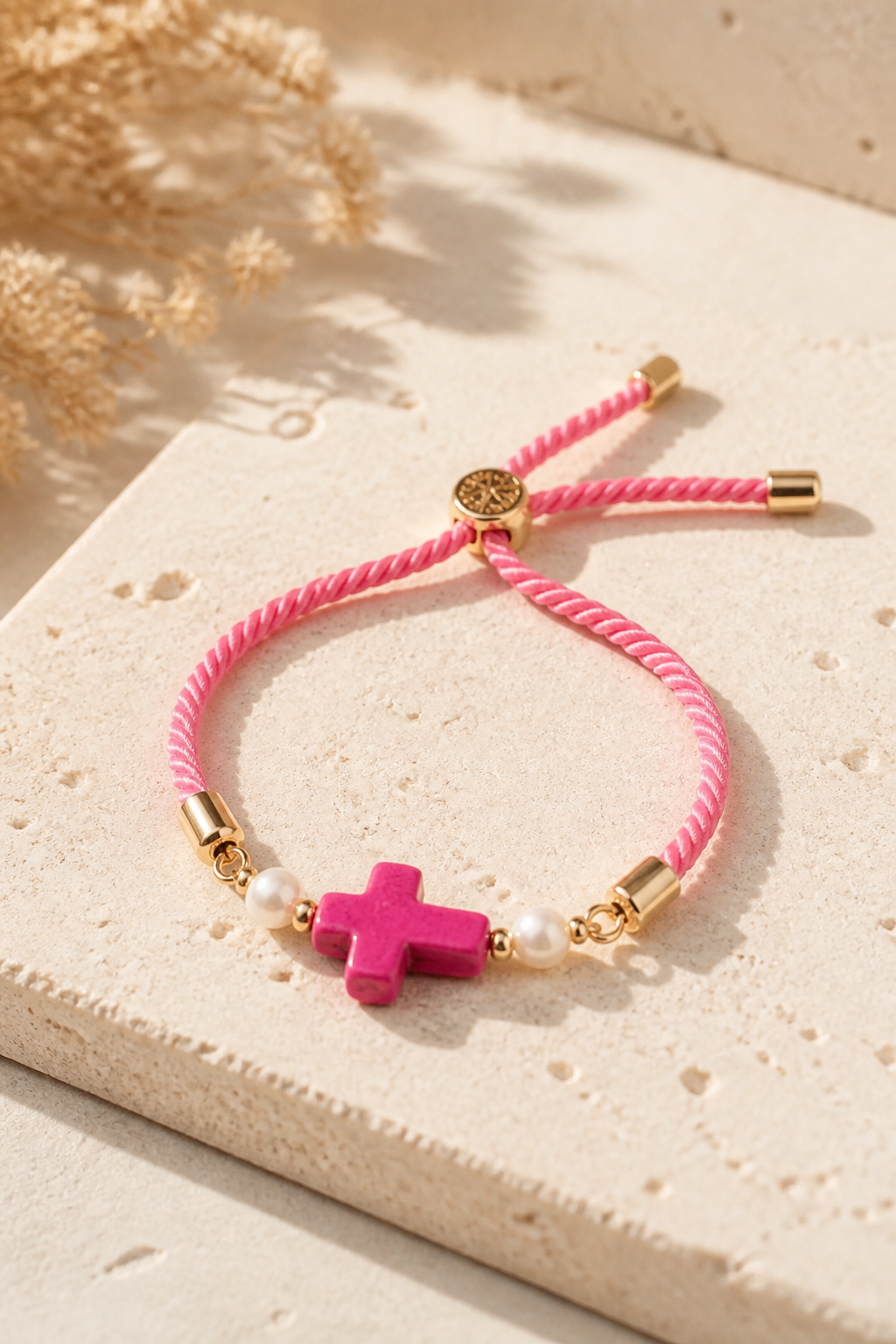 Pulseras en cordón rosado con cruz