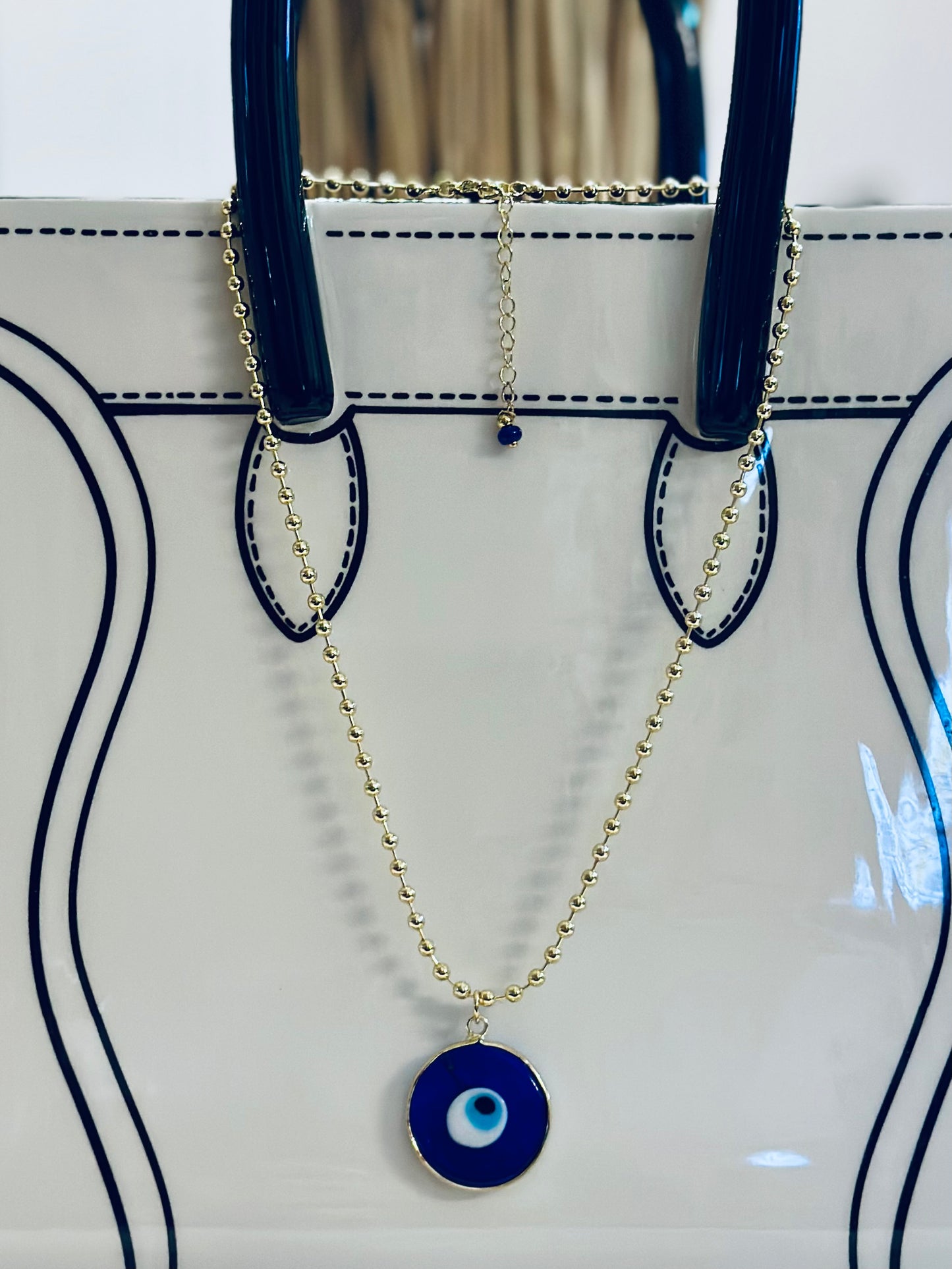 A Cadena estilo militar con baño de oro 18k y dije de Ojo Turco 🧿