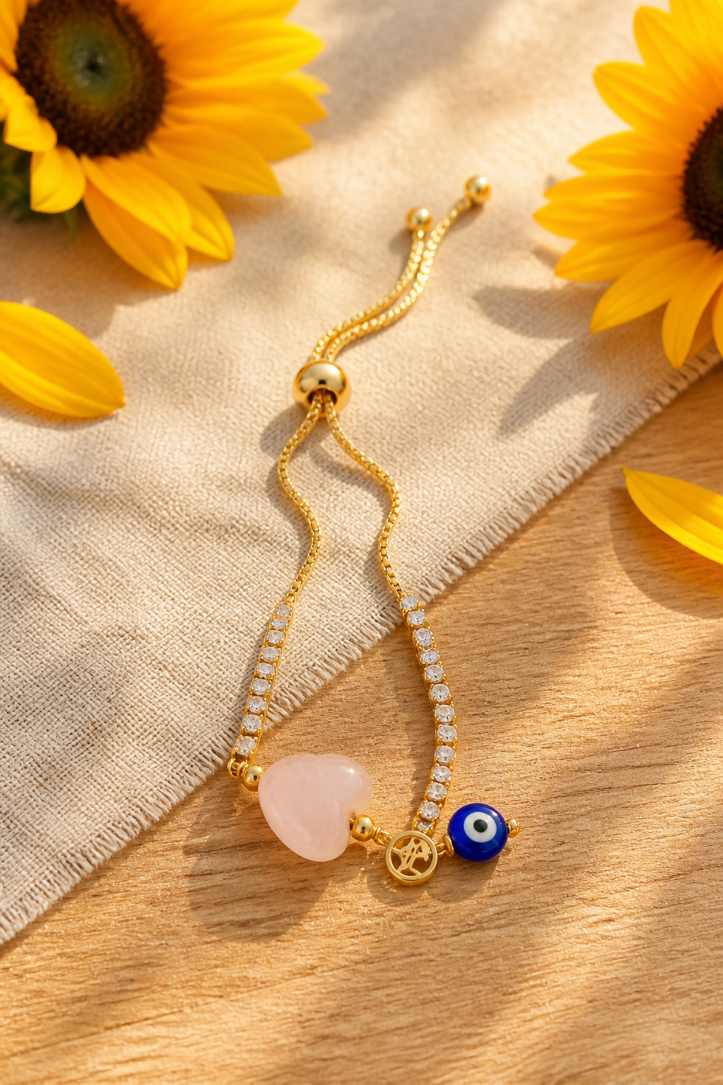 Pulsera de cadena con dije de ojo turco y corazón rosado