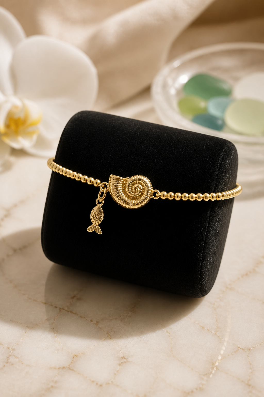 A Pulseras de cadena con dije de Caracol