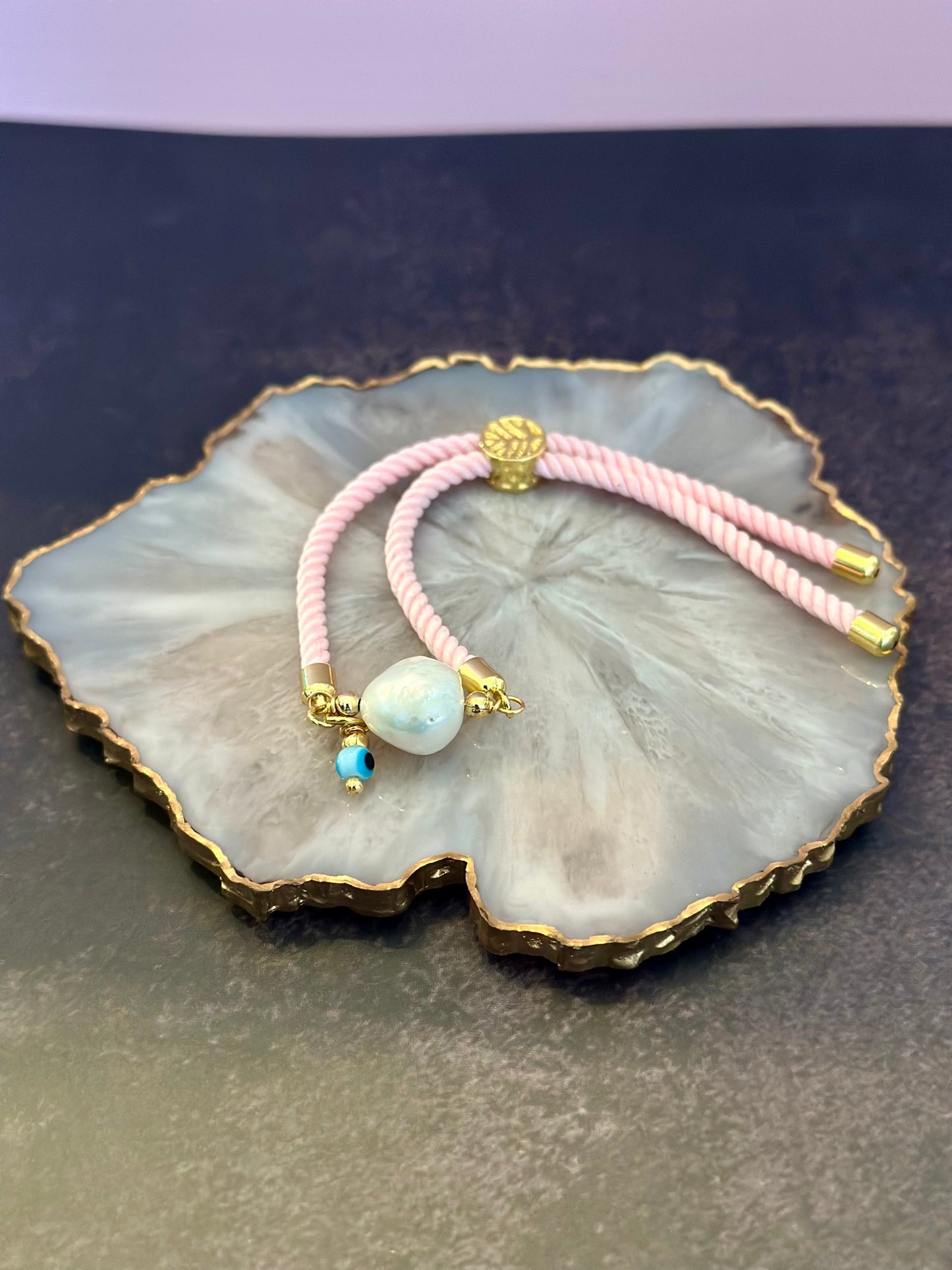Pulseras en Cordón rosado con perla natural