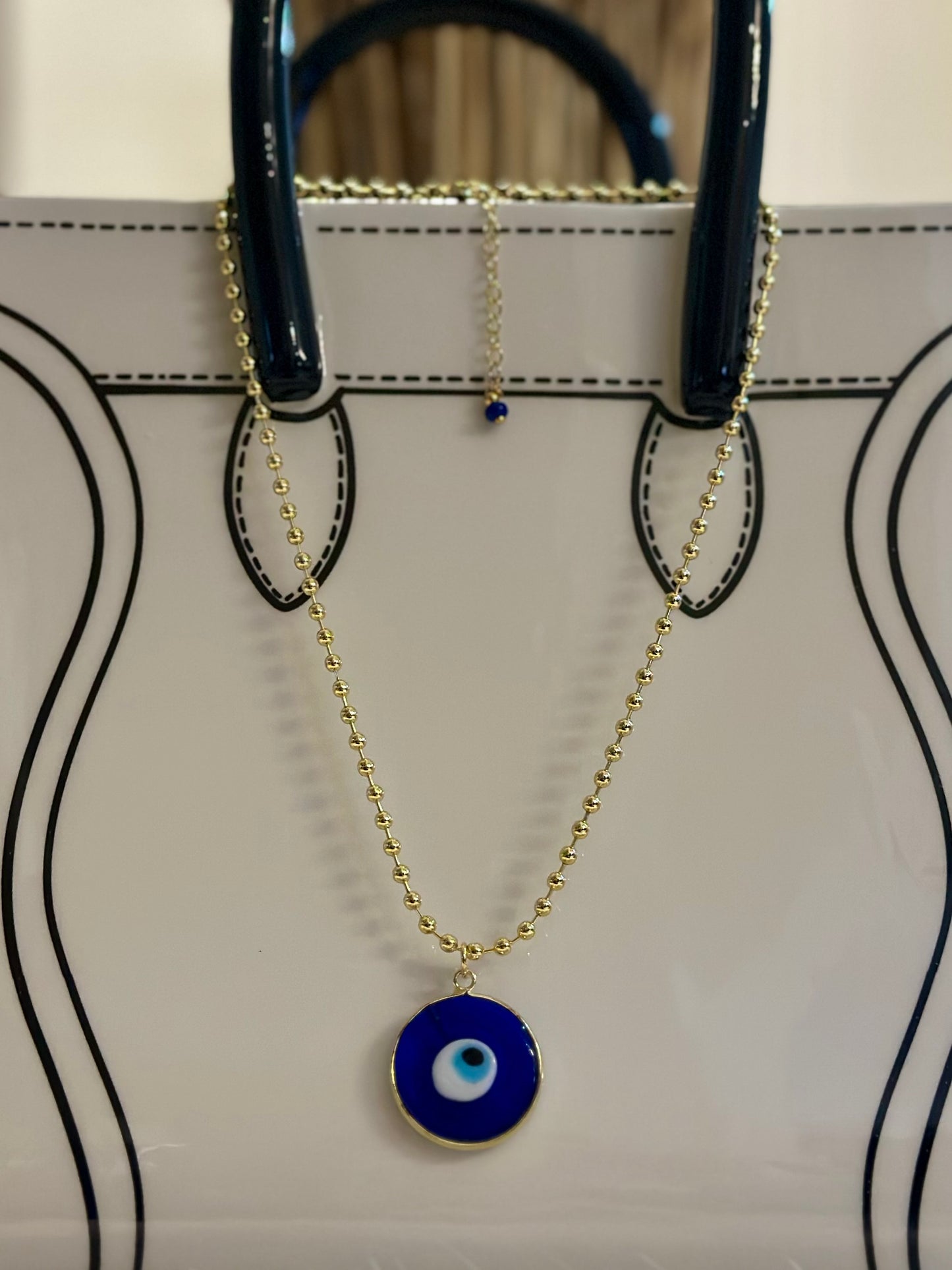 A Cadena estilo militar con baño de oro 18k y dije de Ojo Turco 🧿