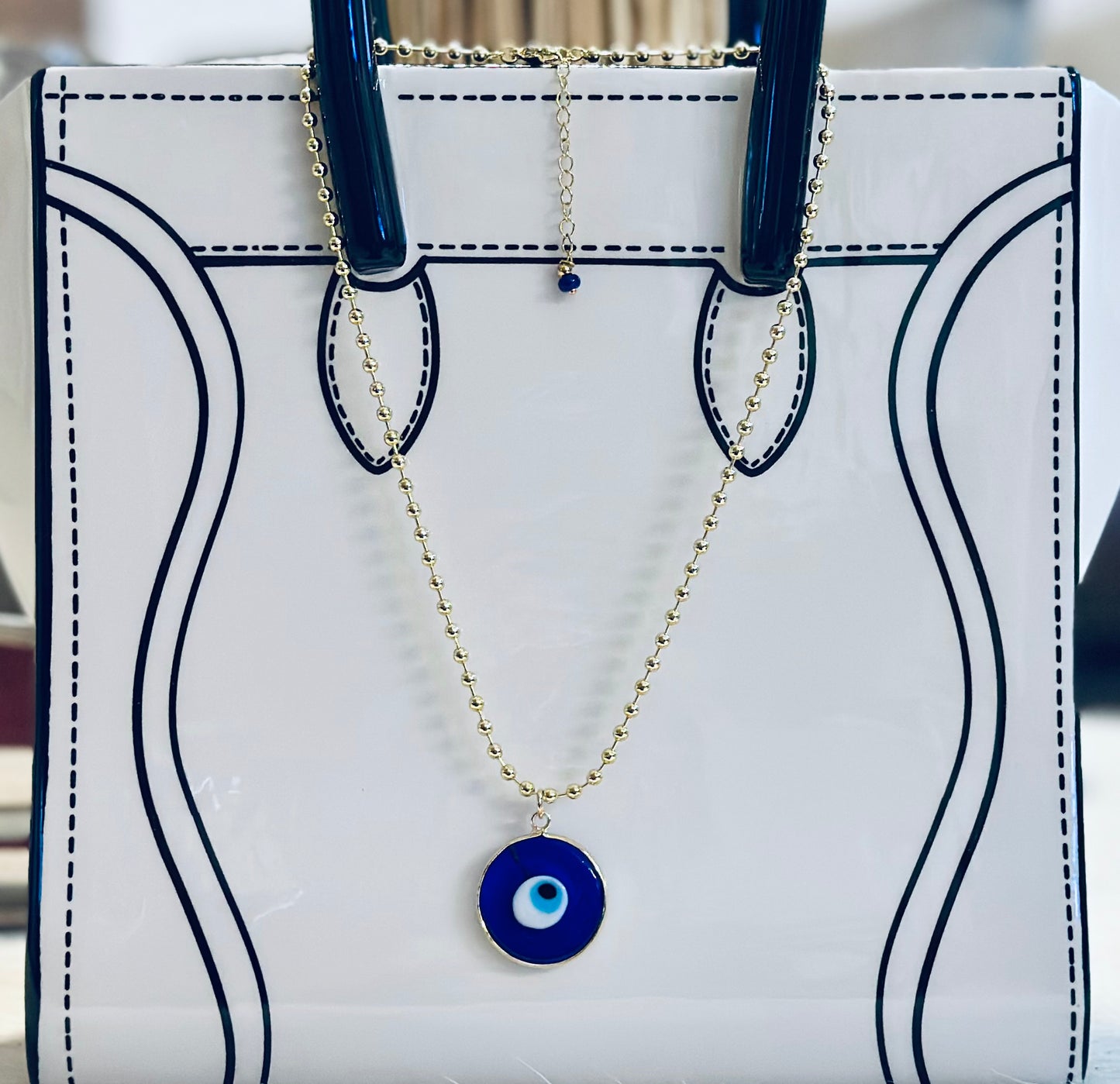 A Cadena estilo militar con baño de oro 18k y dije de Ojo Turco 🧿