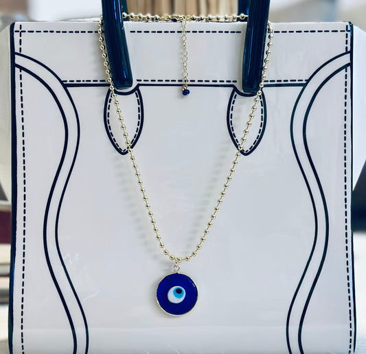 A Cadena estilo militar con baño de oro 18k y dije de Ojo Turco 🧿