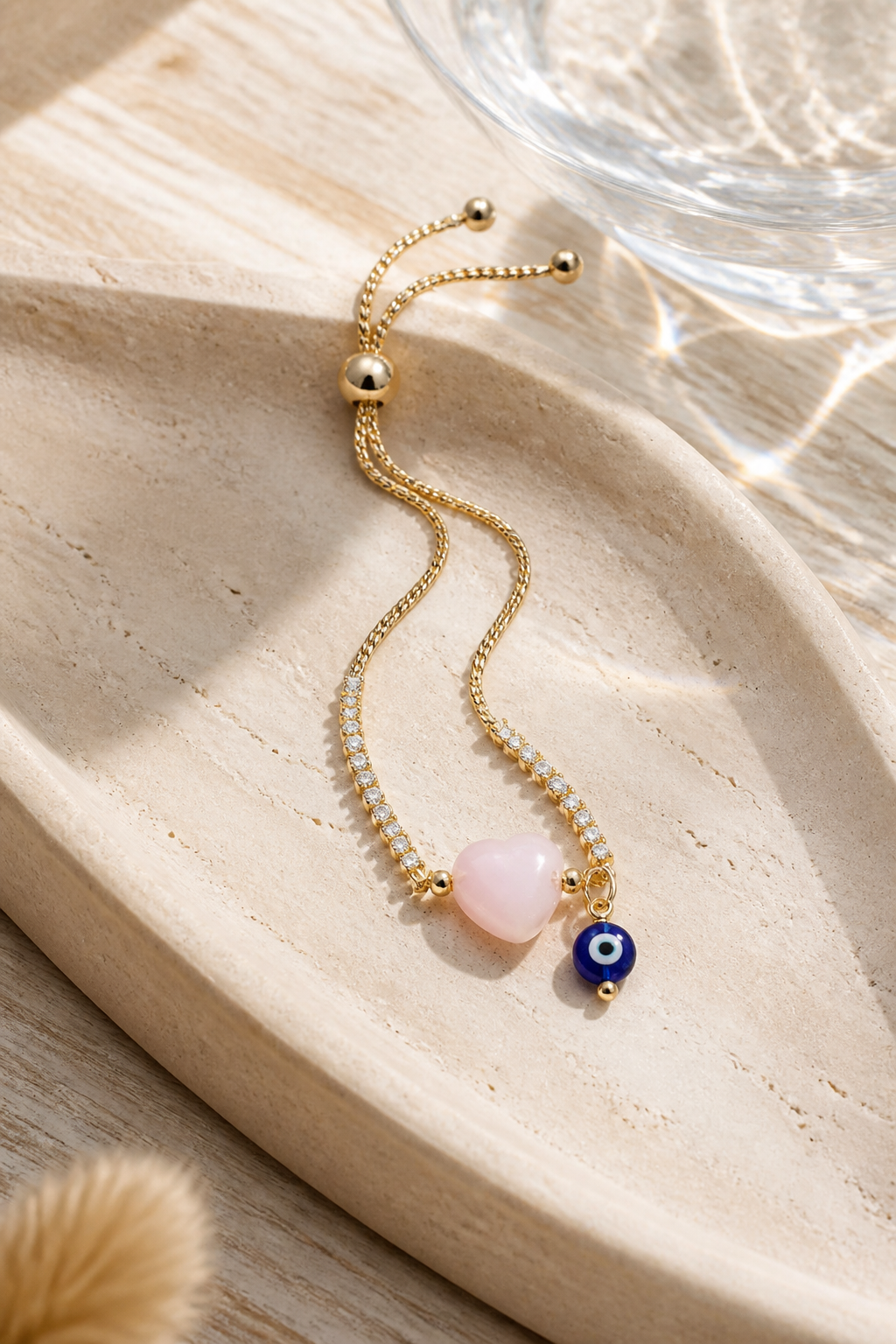 Pulsera de cadena con dije de ojo turco y corazón rosado