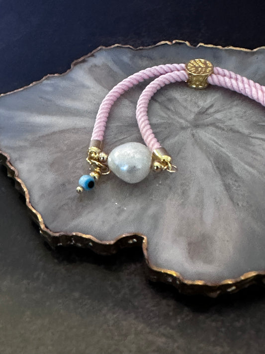 Pulseras en Cordón rosado con perla natural