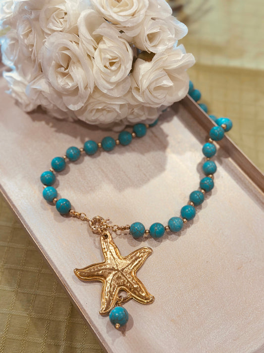 A Collar de piedras Turquesa y dije de Estrella con baño de oro 18k