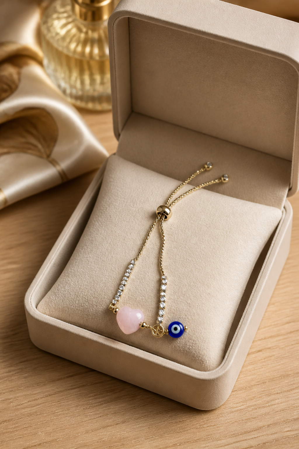 Pulsera de cadena con dije de ojo turco y corazón rosado