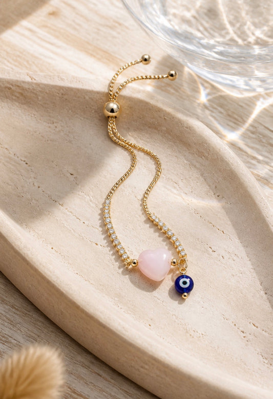 A Pulsera en cadena con dije de corazón y ojo turco 🧿
